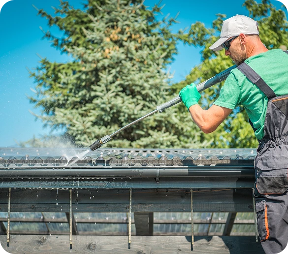 men-washing-his-backyard-garden-concrete-path-stairs-using-pressure-washer